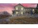 Charming two-story home with a cozy porch and a well-maintained front yard at 3805 Windriver Trl, Castle Rock, CO 80109