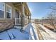 Front porch with railing and steps leading to the entrance at 3805 Windriver Trl, Castle Rock, CO 80109