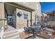 Small patio with table and chairs, next to the house at 3805 Windriver Trl, Castle Rock, CO 80109