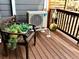 Outdoor balcony features a Daikin AC unit, a wood bench, and views of the surrounding area at 1614 Secrest St, Golden, CO 80401