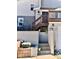 Inviting home entrance featuring stairs leading to a balcony and front door with plants along the way at 1614 Secrest St, Golden, CO 80401