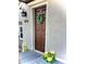 The front door is decorated with a beautiful wreath and bright landscaping at 1614 Secrest St, Golden, CO 80401