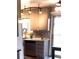 Well-lit kitchen featuring stainless steel appliances, granite countertops, and ample cabinet space at 1614 Secrest St, Golden, CO 80401