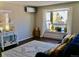 Bright living room with a bay window, comfortable seating, and wood floors at 1614 Secrest St, Golden, CO 80401