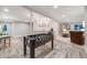 Finished basement featuring a wet bar with pendant lights and a foosball table at 5364 Dunraven Cir, Golden, CO 80403