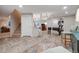 Open basement featuring a stairway, wet bar, living area, a treadmill, and foosball table at 5364 Dunraven Cir, Golden, CO 80403