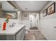 Modern bathroom with subway tile, frameless shower, and stylish vanity at 5364 Dunraven Cir, Golden, CO 80403