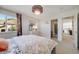 Bedroom featuring natural light, a view of a mountain, and access to a bathroom at 5364 Dunraven Cir, Golden, CO 80403