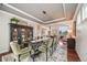 Charming dining room featuring a decorative rug, stylish seating and modern lighting fixture at 5364 Dunraven Cir, Golden, CO 80403
