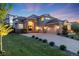 Beautiful home featuring a well-maintained lawn and a spacious three-car garage at 5364 Dunraven Cir, Golden, CO 80403