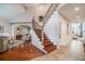 Elegant foyer featuring hardwood floors, a staircase, and high ceilings for a grand entrance at 5364 Dunraven Cir, Golden, CO 80403