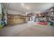Spacious garage with ample storage, organization systems, and room for multiple vehicles at 5364 Dunraven Cir, Golden, CO 80403