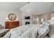 Inviting main bedroom showcases a fireplace, chandelier, and natural light, creating a relaxing and luxurious retreat at 5364 Dunraven Cir, Golden, CO 80403