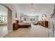 Large main bedroom includes a fireplace, ample natural light, and adjacent bath area, offering a relaxing retreat at 5364 Dunraven Cir, Golden, CO 80403
