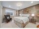 Serene main bedroom showcasing wood accent wall, soft lighting, and ample space at 5364 Dunraven Cir, Golden, CO 80403
