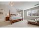 Spacious main bedroom featuring a vaulted ceiling, chandelier, and large windows, offering a serene and stylish retreat at 5364 Dunraven Cir, Golden, CO 80403