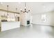Open concept living area with a modern fireplace, stylish lighting, and access to the kitchen at 5788 N Killarney Way, Aurora, CO 80019