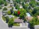 Overhead view shows a home in a well-established neighborhood with a pool and mature landscaping at 6143 S Ash E Cir, Centennial, CO 80121