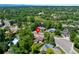 A home nestled among mature trees in a neighborhood with other well-maintained homes at 6143 S Ash E Cir, Centennial, CO 80121