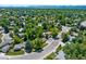 Overhead view shows a home in a neighborhood with mature trees and a community pool at 6143 S Ash E Cir, Centennial, CO 80121