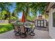 Back deck featuring outdoor dining set and seating, overlooking a well-manicured lawn and shed at 6143 S Ash E Cir, Centennial, CO 80121