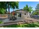 Spacious back deck with dining and seating areas, perfect for outdoor relaxation and entertaining at 6143 S Ash E Cir, Centennial, CO 80121