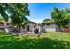 Spacious backyard featuring a large deck, lush lawn, perfect for entertaining and outdoor enjoyment at 6143 S Ash E Cir, Centennial, CO 80121