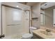 Bathroom featuring sleek glass-enclosed shower, modern sink, and neutral color palette at 6143 S Ash E Cir, Centennial, CO 80121