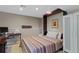 Cozy bedroom with striped quilt, built-in desk, and ample storage space in wardrobe at 6143 S Ash E Cir, Centennial, CO 80121