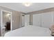 Bright bedroom with double closets, neutral decor, and ensuite bathroom at 6143 S Ash E Cir, Centennial, CO 80121