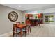 Open floorplan features dining room adjacent to a large, updated kitchen at 6143 S Ash E Cir, Centennial, CO 80121