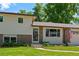 Charming home with well-kept lawn, fresh plantings, two-car garage and inviting front entrance at 6143 S Ash E Cir, Centennial, CO 80121