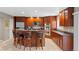 Gourmet kitchen featuring custom wood cabinetry, granite countertops, and stainless steel appliances at 6143 S Ash E Cir, Centennial, CO 80121