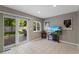 Cozy living room featuring tile floors and a view of outdoor patio at 6143 S Ash E Cir, Centennial, CO 80121