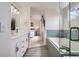 Spa-like bathroom with double vanity, soaking tub, separate shower, and stylish gray flooring at 23709 Glenmoor Dr, Parker, CO 80138