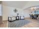 Well-lit living room featuring hardwood floors, neutral decor, and an open floor plan at 23709 Glenmoor Dr, Parker, CO 80138