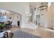 Bright and open living space featuring a grand staircase and dining area at 23709 Glenmoor Dr, Parker, CO 80138