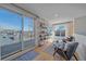 Bright sitting area with sliding glass doors to the patio, and city views, offering indoor-outdoor living at 3135 W 25Th Ave, Denver, CO 80211