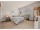 Cozy bedroom with carpet flooring, natural light, and comfortable furnishings at 22312 E Plymouth Cir, Aurora, CO 80016