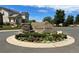 Stone sign for Shadow Creek community, featuring landscaping and neighborhood homes in the background at 22312 E Plymouth Cir, Aurora, CO 80016