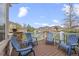 Inviting outdoor deck with blue Adirondack chairs and stone accents, perfect for entertaining or relaxing outdoors at 22312 E Plymouth Cir, Aurora, CO 80016