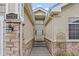 Inviting front entrance with stone pillars and decorative lighting at 22312 E Plymouth Cir, Aurora, CO 80016