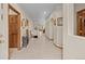 Hallway with tile flooring, and neutral walls leading to various rooms in the home at 22312 E Plymouth Cir, Aurora, CO 80016