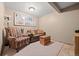 Cozy Gathering room with comfortable seating and bright ceiling light creating a warm and inviting atmosphere at 22312 E Plymouth Cir, Aurora, CO 80016
