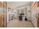 Bright home office featuring natural light from bay windows and a functional workspace, ideal for remote work or study at 22312 E Plymouth Cir, Aurora, CO 80016