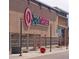 Super Target store with recognizable logo and entrance, with dark pedestrian street lights outside at 22312 E Plymouth Cir, Aurora, CO 80016