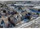 Wide aerial view of apartment complex and surrounding retail stores at 14221 E 1St Dr # 304, Aurora, CO 80011