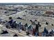 Aerial perspective of apartment building near highway and retail at 14221 E 1St Dr # 304, Aurora, CO 80011
