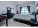 Comfortable bedroom with a large bed and city views at 14221 E 1St Dr # 304, Aurora, CO 80011