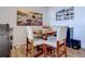 Small dining area with a wooden table and four chairs at 14221 E 1St Dr # 304, Aurora, CO 80011